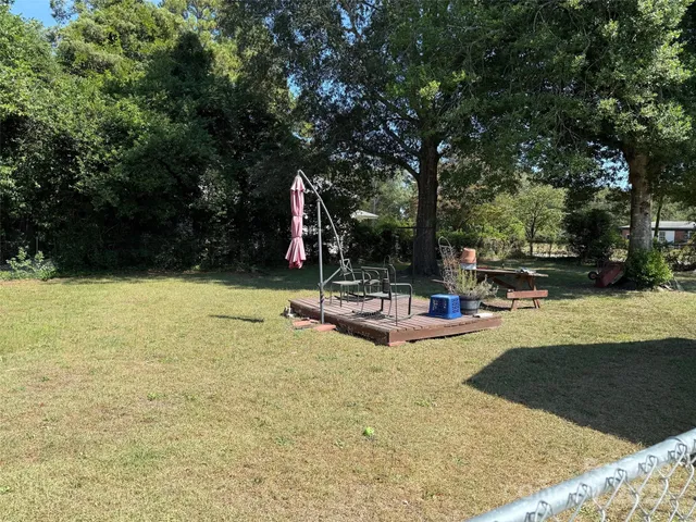 a view of a swimming pool with sitting area