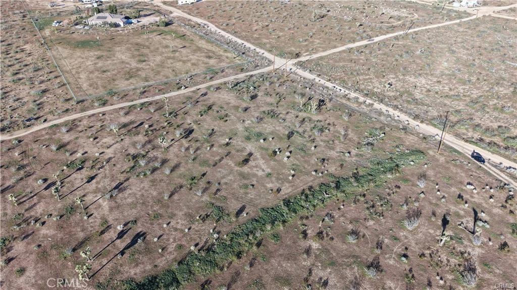 111 Rochester Road Phelan, CA 92371 - Photo 7 of 9 a view of a dry yard with wooden floor and fence