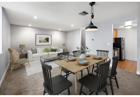 a view of a dining room with furniture