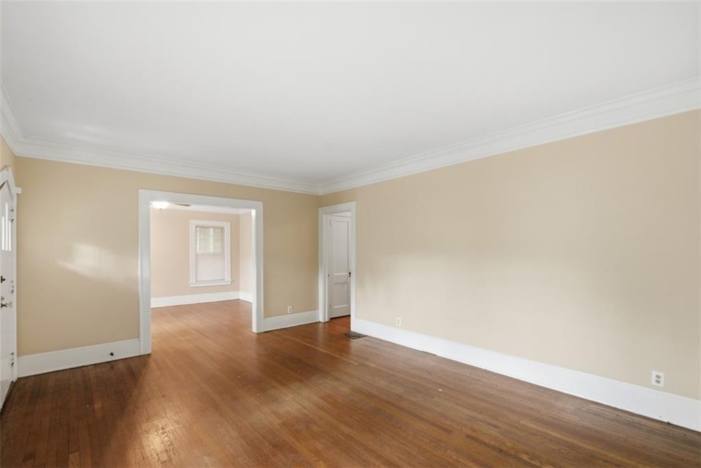 1424 Emory Road Northeast Atlanta, GA 30306 - Photo 8 of 36 a view of an empty room and wooden floor