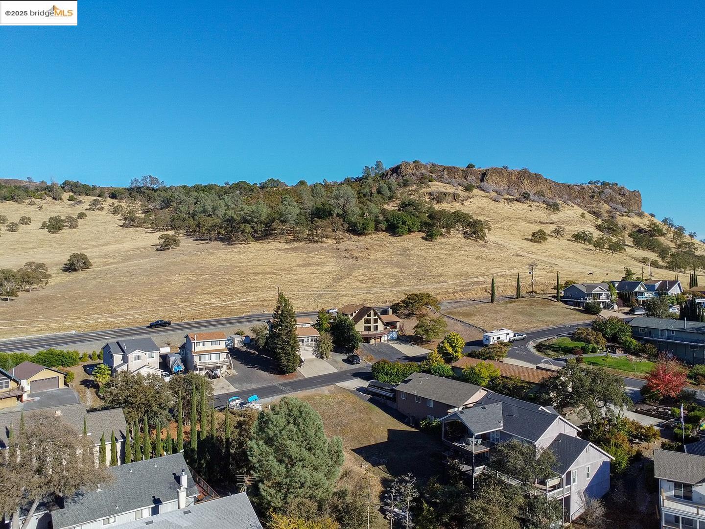 501 Indian Hill Road Copperopolis, CA 95228 - Photo 8 of 13 a view of a lake with a mountain in the background