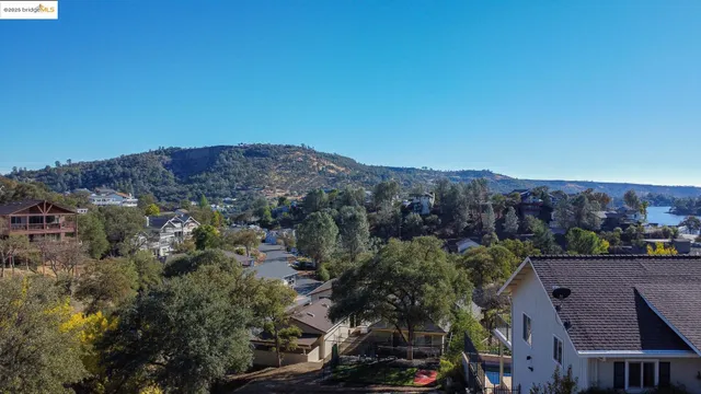an aerial view of residential house and green space
