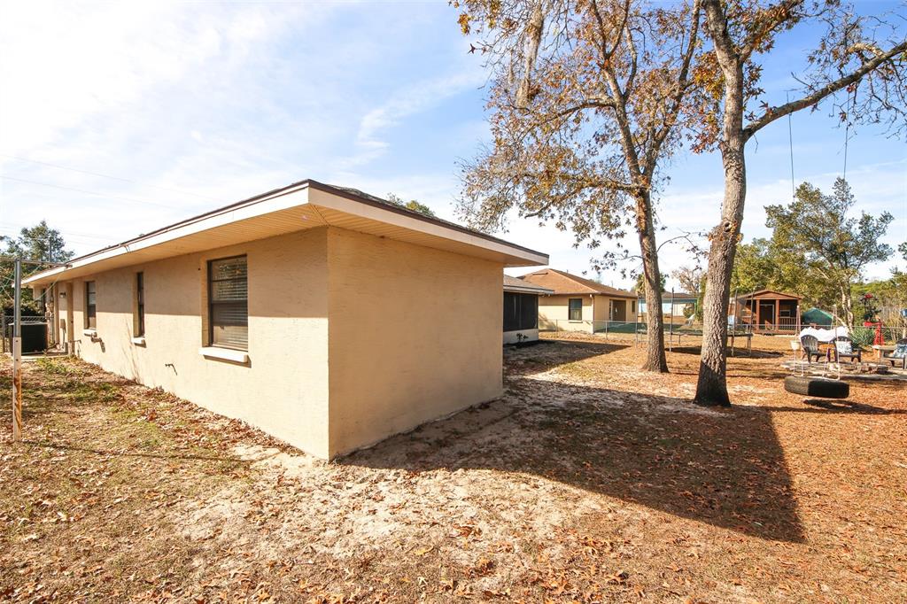 13277 Delbarton Street Spring Hill, FL 34609 - Photo 18 of 22 a front view of a house with a yard