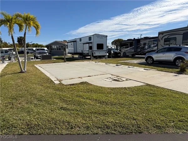a view of multiple houses with a yard