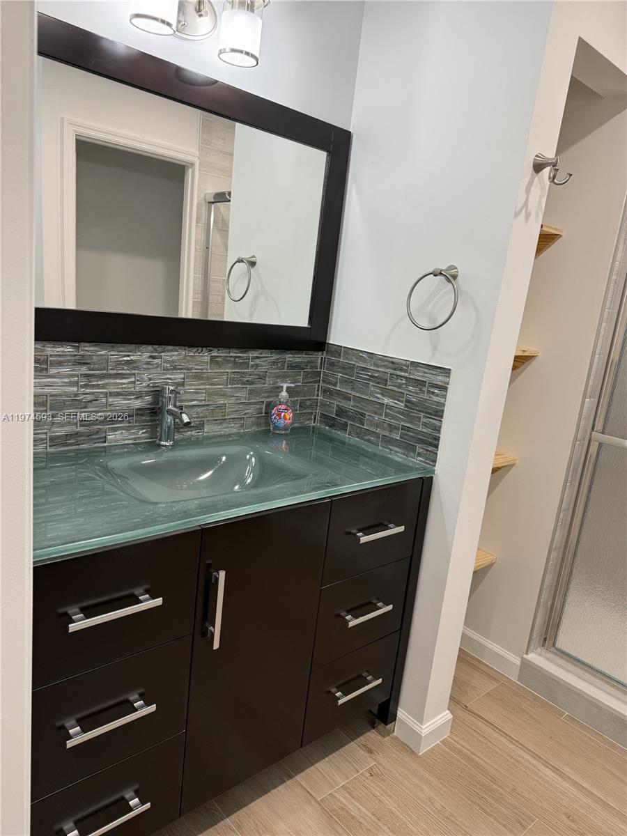 Southwest Ranches Southwest Ranches, FL 33331 - Photo 6 of 12 a bathroom with a sink vanity and a mirror