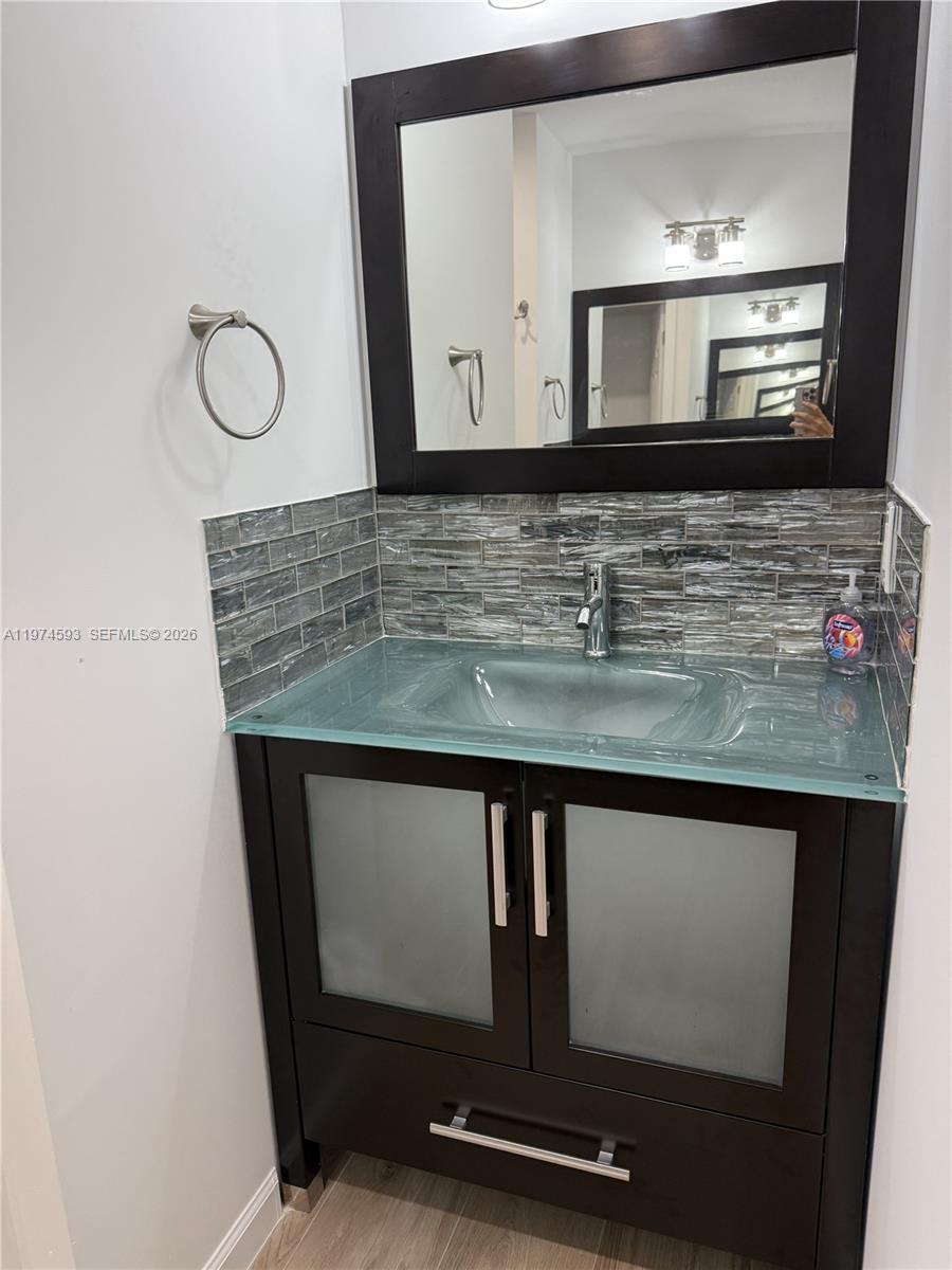 Southwest Ranches Southwest Ranches, FL 33331 - Photo 7 of 12 a bathroom with a granite countertop sink a mirror and