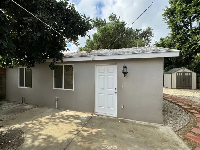 a house with trees in the background