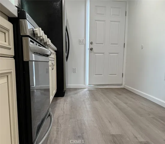 an empty room with wooden floor