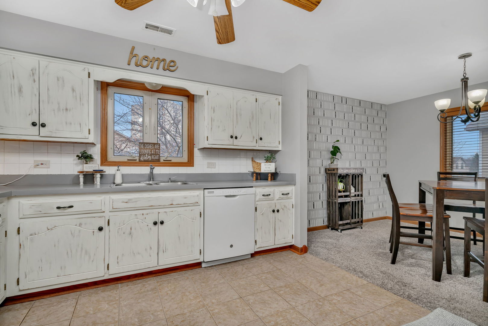 2670 Jodee Drive, Unit B Joliet, IL 60436 - Photo 12 of 23 a kitchen with granite countertop white cabinets and stainless steel appliances
