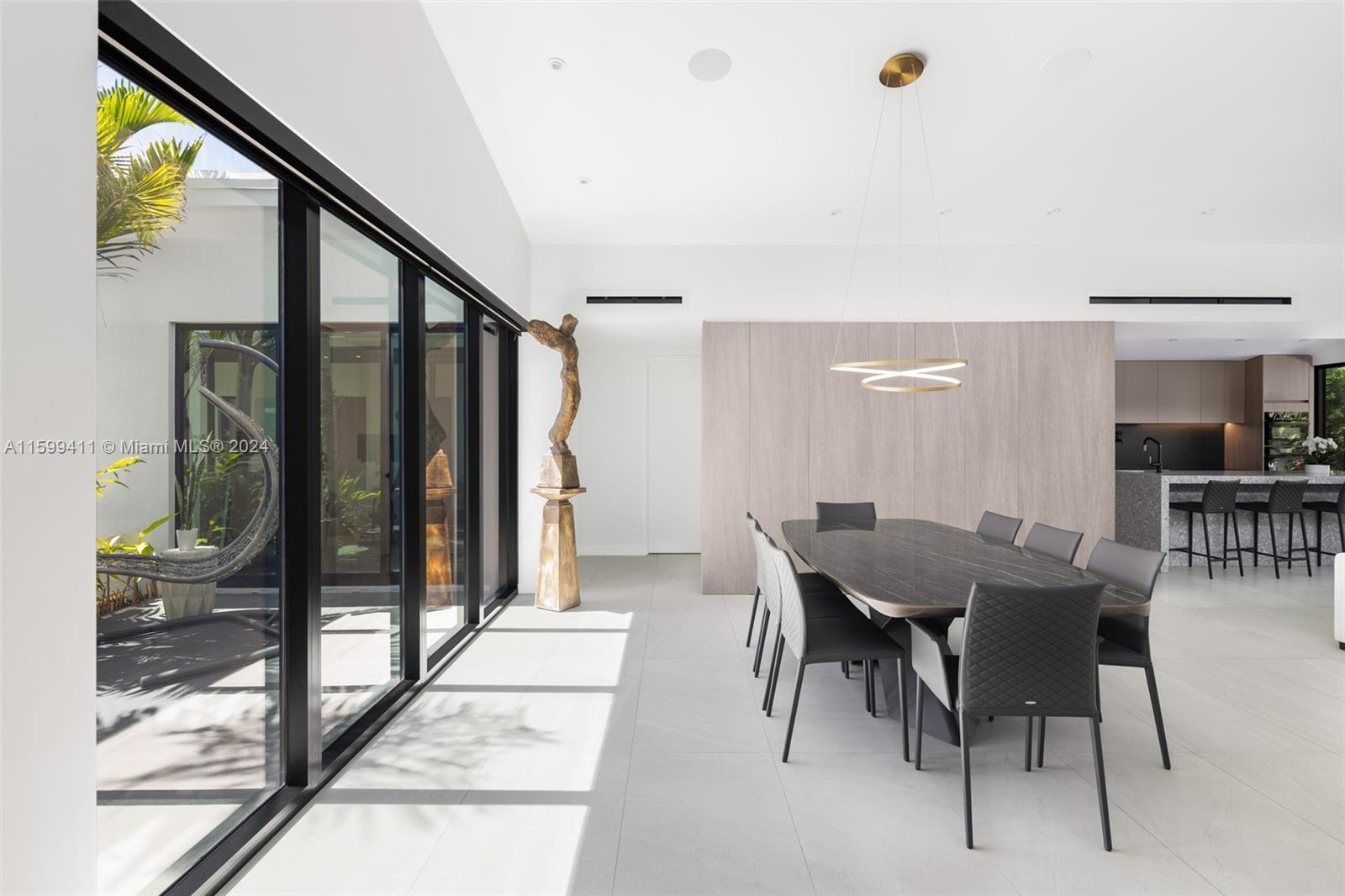 5225 La Gorce Drive Miami Beach, FL 33140 - Photo 13 of 64 a view of a dining room with furniture window and wooden floor
