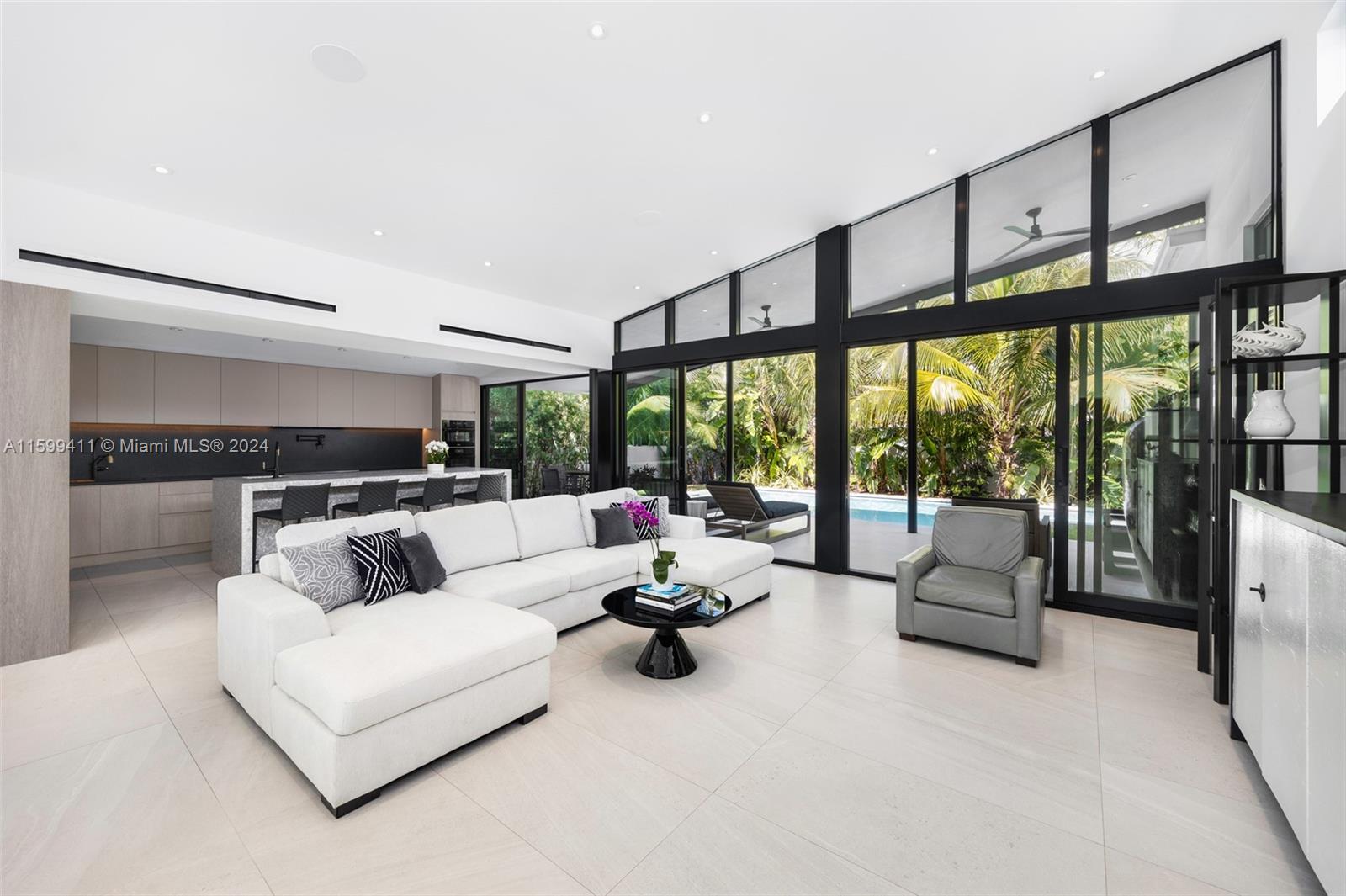5225 La Gorce Drive Miami Beach, FL 33140 - Photo 16 of 64 a living room with furniture and floor to ceiling windows