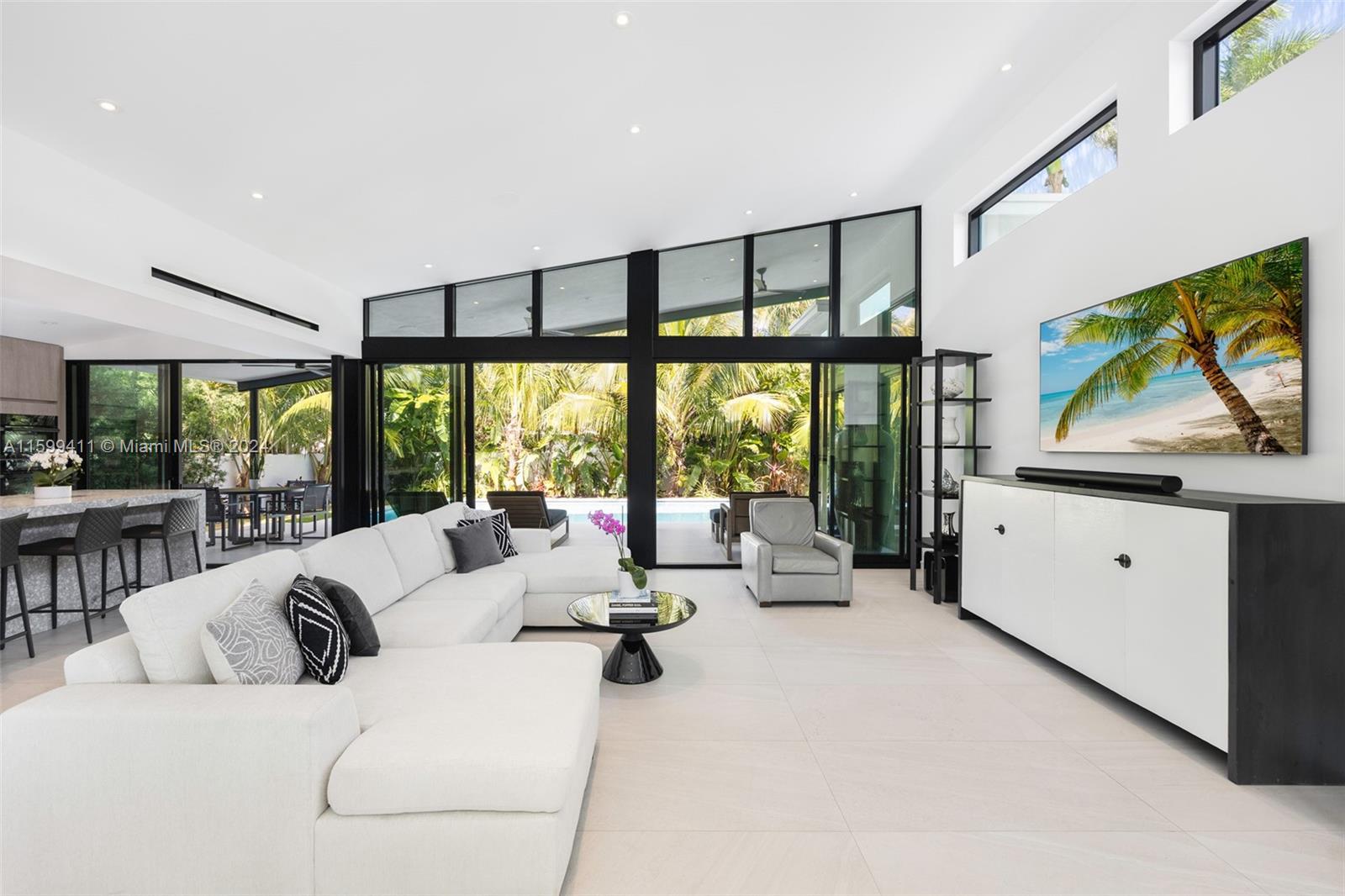 5225 La Gorce Drive Miami Beach, FL 33140 - Photo 18 of 64 a living room with furniture and a flat screen tv