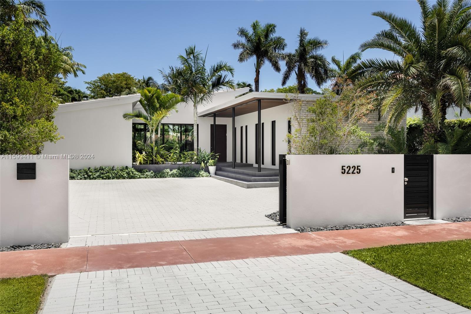 5225 La Gorce Drive Miami Beach, FL 33140 - Photo 2 of 64 a view of a white house with palm trees