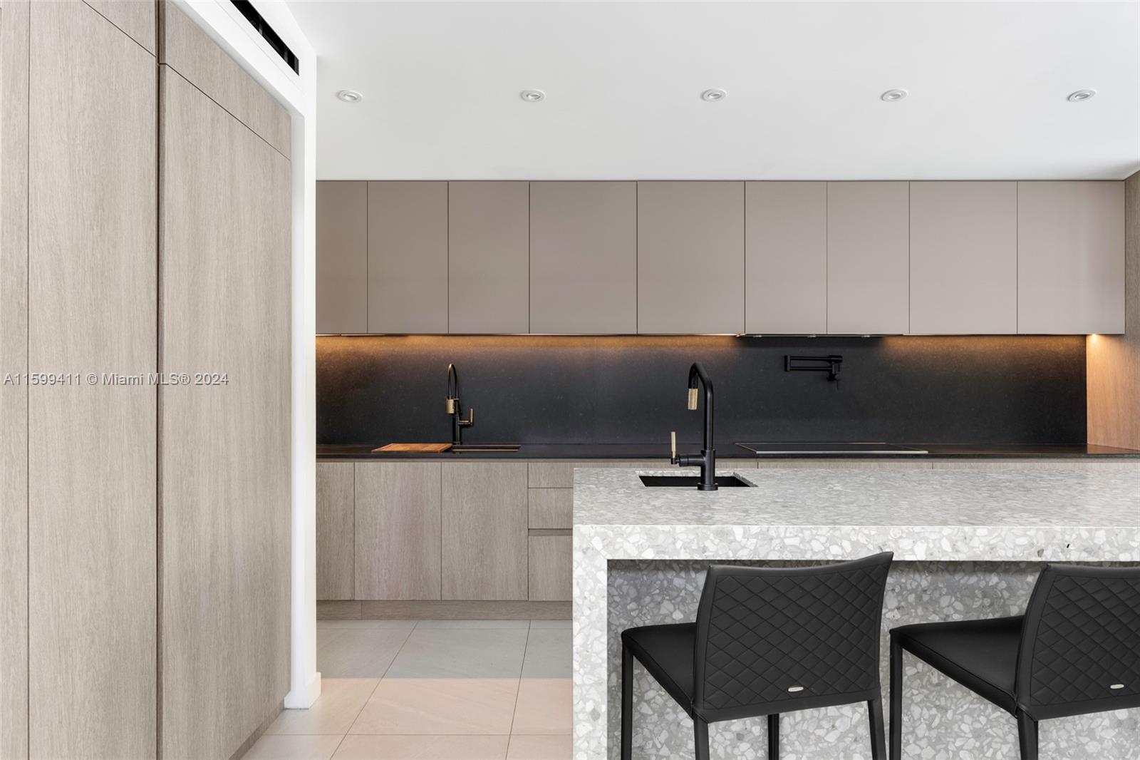 5225 La Gorce Drive Miami Beach, FL 33140 - Photo 24 of 64 a kitchen with a sink and cabinets