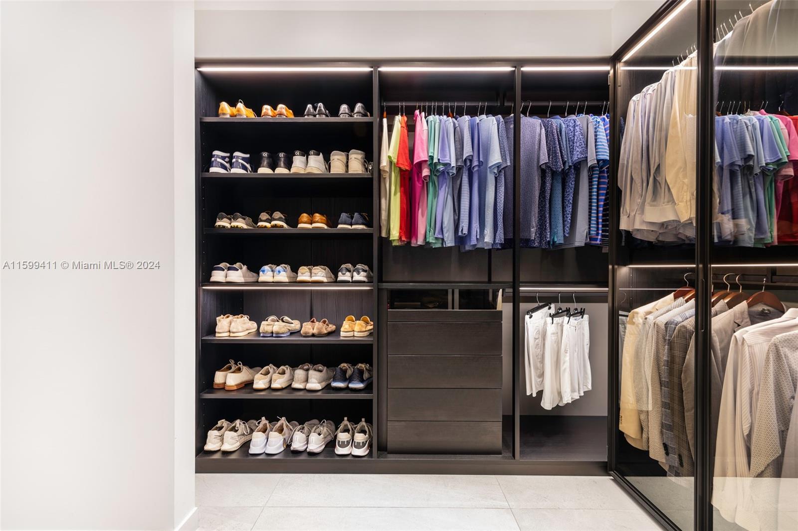 5225 La Gorce Drive Miami Beach, FL 33140 - Photo 37 of 64 a view of walk in closet with clothes and shoes