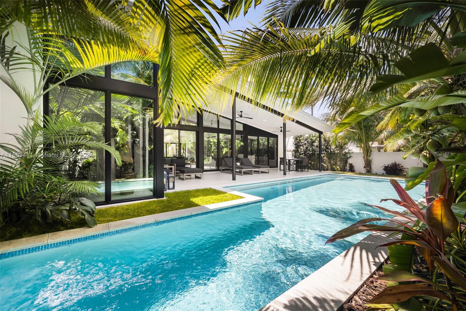 5225 La Gorce Drive Miami Beach, FL 33140 - Photo 48 of 64 a view of swimming pool with palm trees