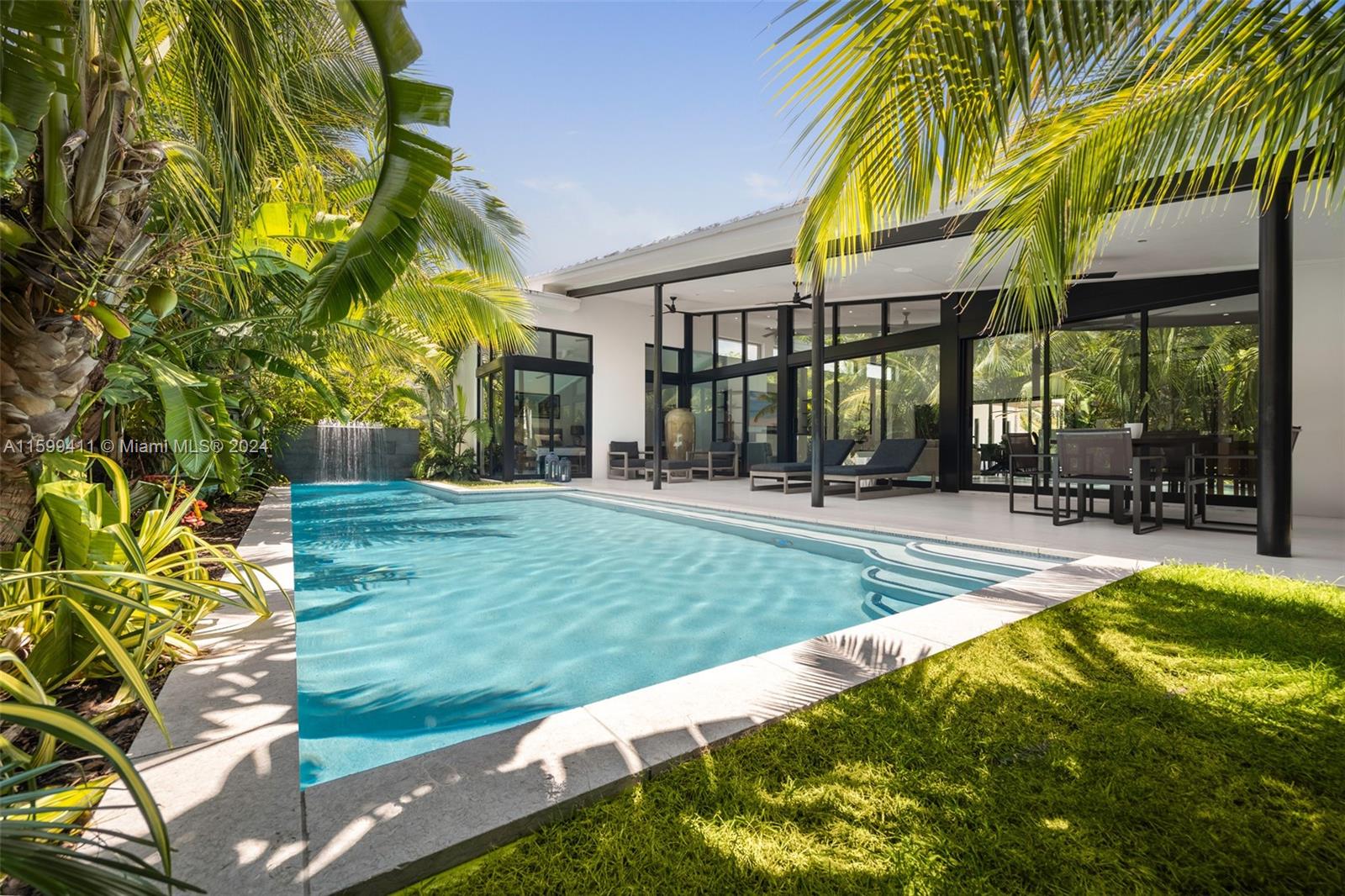 5225 La Gorce Drive Miami Beach, FL 33140 - Photo 49 of 64 a view of a house with swimming pool and sitting area