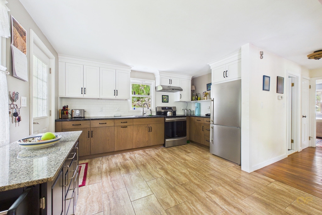 70 Neponset Street Canton, MA 02021 - Photo 11 of 39 a kitchen with stainless steel appliances granite countertop a refrigerator sink and cabinets