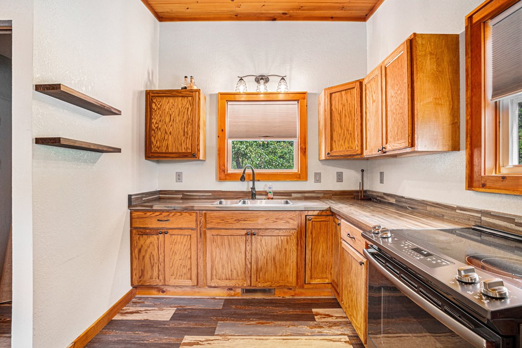 177 Main Street Copperhill, TN 37317 - Photo 11 of 26 a view of a kitchen with a sink and a window