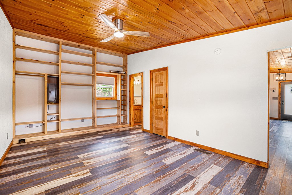 177 Main Street Copperhill, TN 37317 - Photo 14 of 26 a view of an empty room with wooden floor and a window