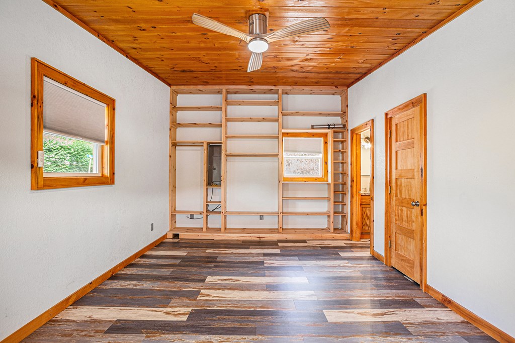 177 Main Street Copperhill, TN 37317 - Photo 17 of 26 a view of an empty room with wooden floor and a window