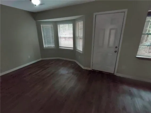 an empty room that has a window