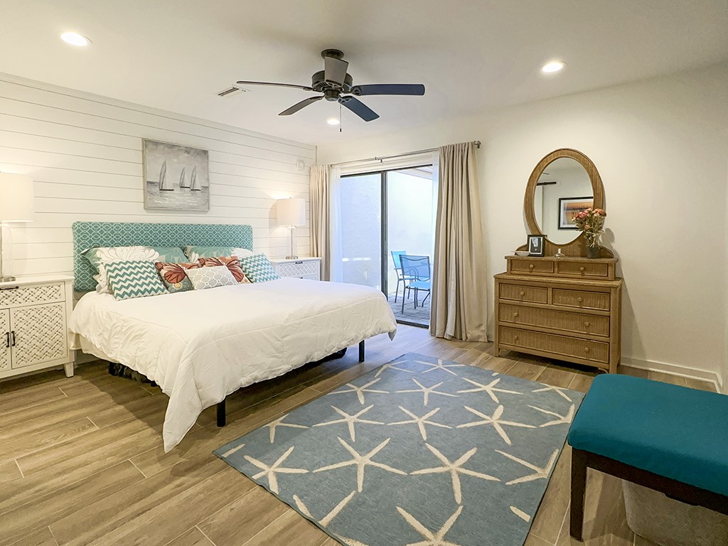 3211 Sea Marsh Road Fernandina Beach, FL 32034 - Photo 12 of 30 a bedroom with a bed and a table