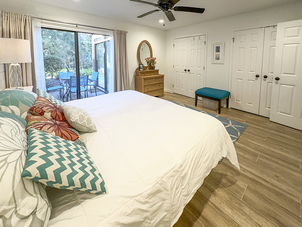 3211 Sea Marsh Road Fernandina Beach, FL 32034 - Photo 14 of 30 a bedroom with a bed and wooden floor