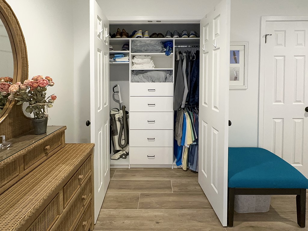 3211 Sea Marsh Road Fernandina Beach, FL 32034 - Photo 15 of 30 a view of walk in closet with clothes and shoes