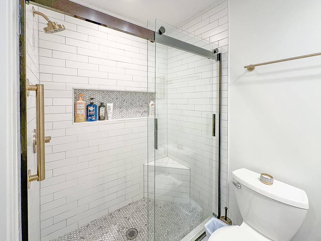 3211 Sea Marsh Road Fernandina Beach, FL 32034 - Photo 17 of 30 a bathroom with a shower and a toilet