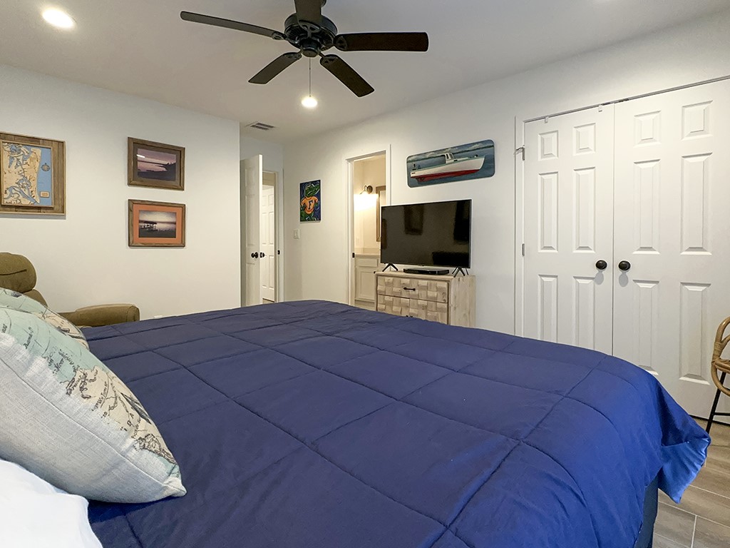 3211 Sea Marsh Road Fernandina Beach, FL 32034 - Photo 19 of 30 a bedroom with a bed and a flat screen tv