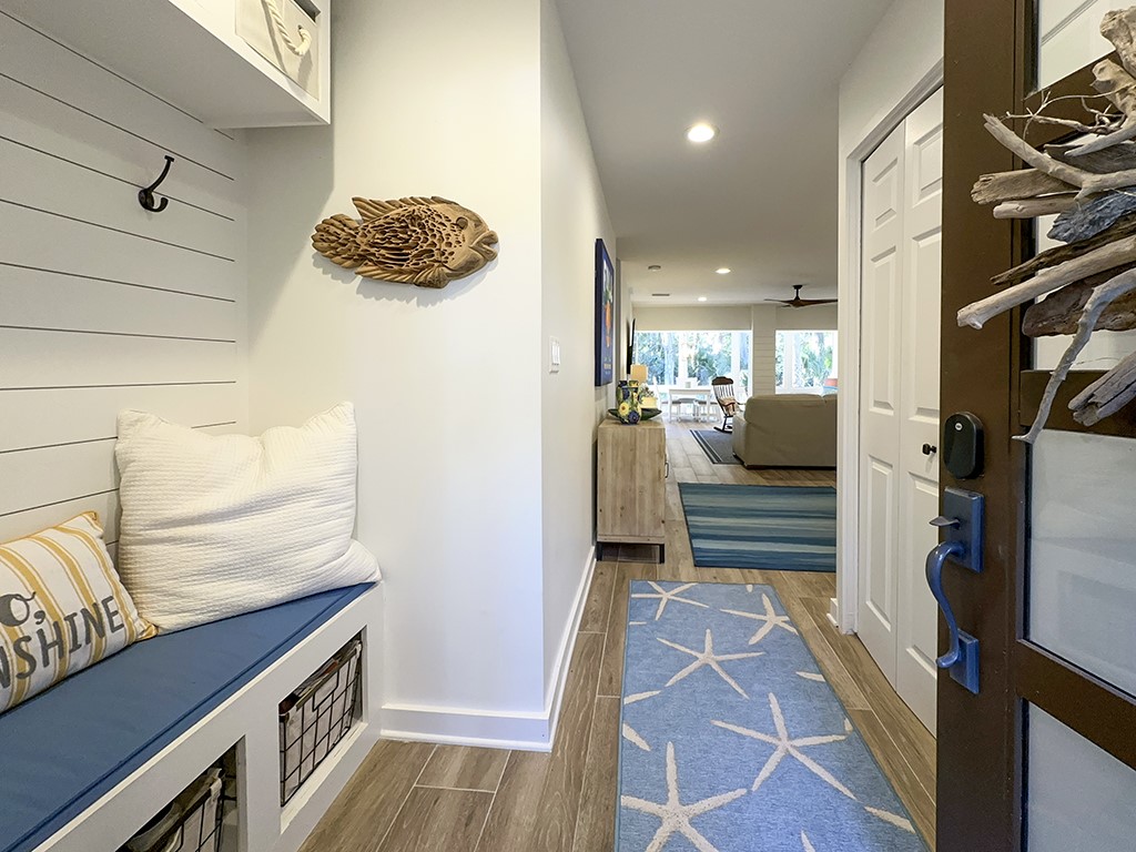 3211 Sea Marsh Road Fernandina Beach, FL 32034 - Photo 2 of 30 a kitchen with stainless steel appliances kitchen island granite countertop a refrigerator and a stove