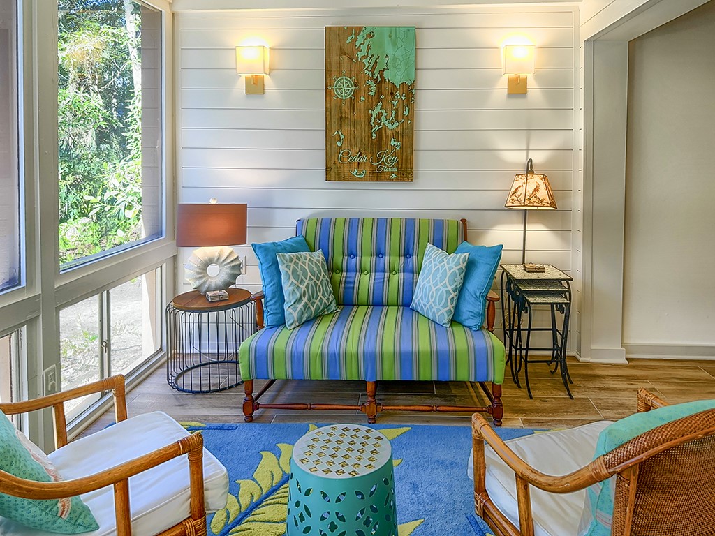 3211 Sea Marsh Road Fernandina Beach, FL 32034 - Photo 23 of 30 a view of an chairs and tables in the balcony