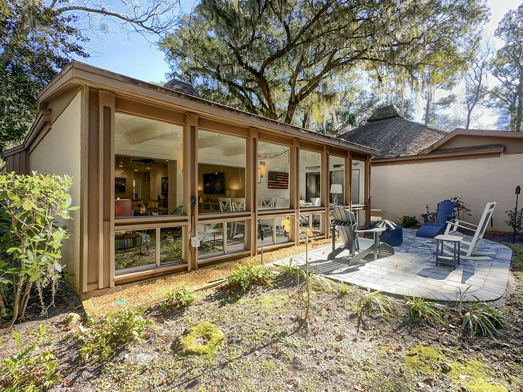 3211 Sea Marsh Road Fernandina Beach, FL 32034 - Photo 27 of 30 a backyard of a house with yard and outdoor seating