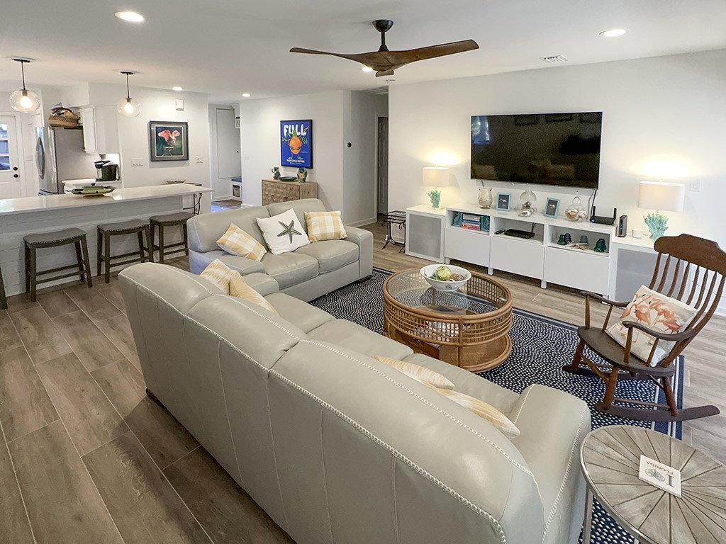 3211 Sea Marsh Road Fernandina Beach, FL 32034 - Photo 5 of 30 a living room with furniture and a flat screen tv