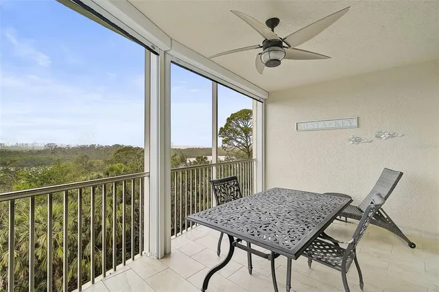 a view of a house with backyard sitting area and swimming pool