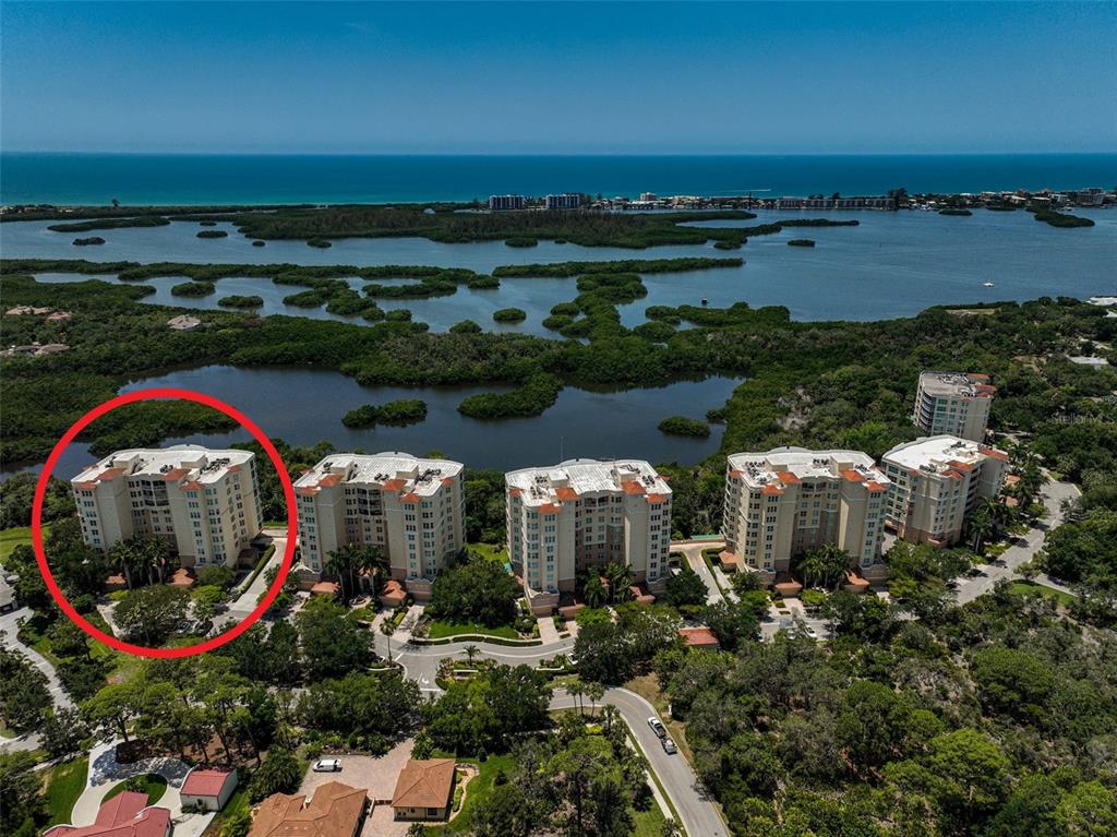 385 North Point Road, Unit 402 Osprey, FL 34229 - Photo 3 of 62 an aerial view of a house with a yard and lake view