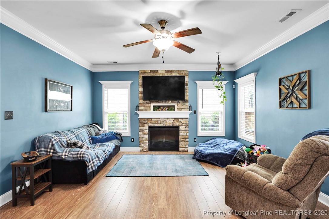 831 Thrush Drive Vass, NC 28394 - Photo 11 of 35 a living room with furniture fireplace and flat screen tv