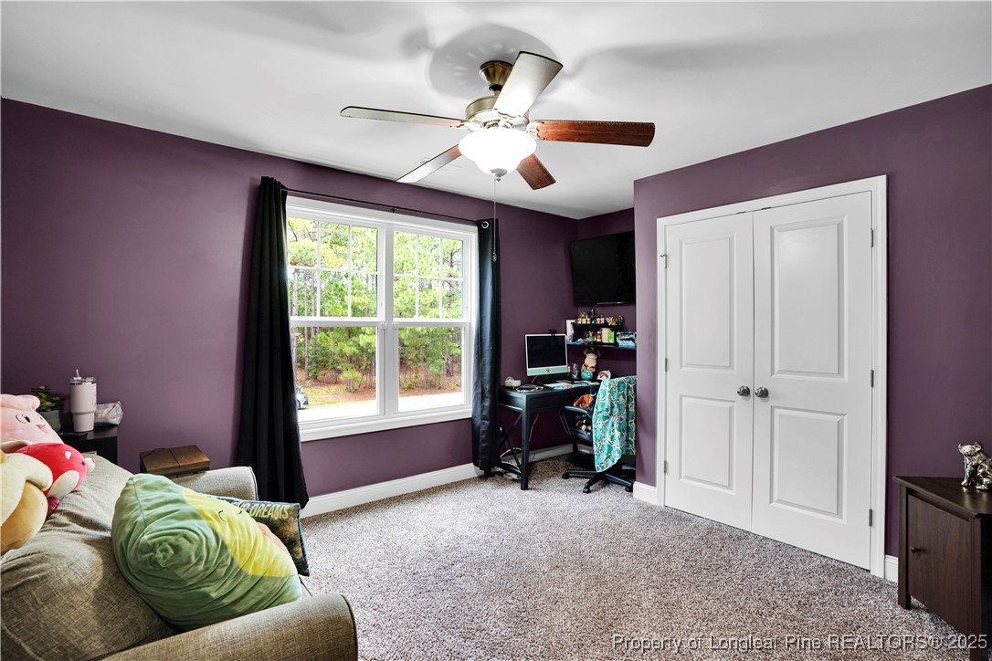 831 Thrush Drive Vass, NC 28394 - Photo 24 of 35 a living room with furniture and a window