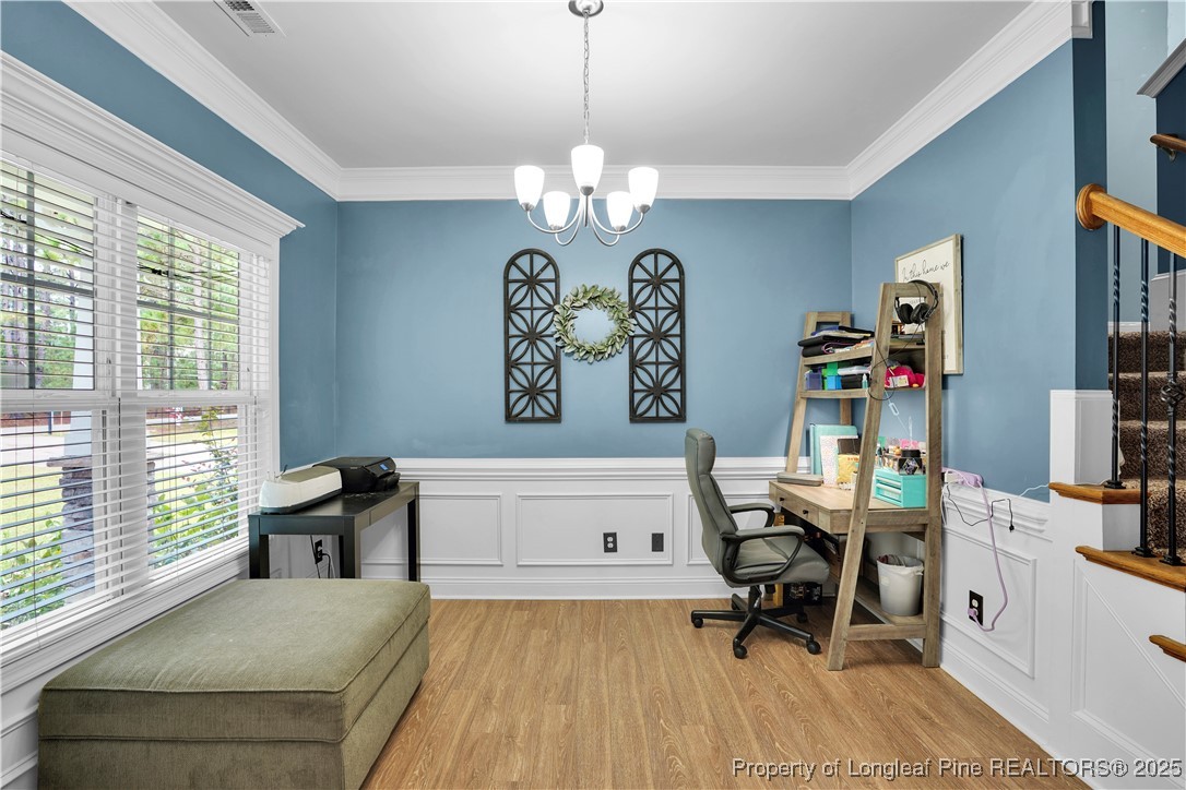831 Thrush Drive Vass, NC 28394 - Photo 7 of 35 a view of a workspace with furniture and a window