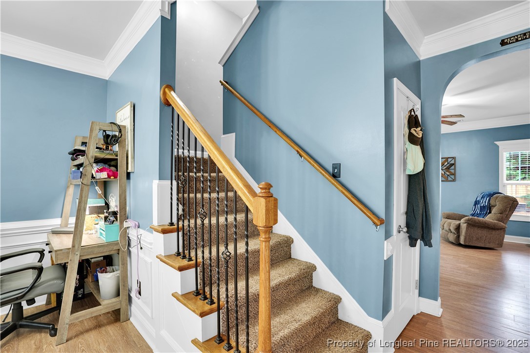 831 Thrush Drive Vass, NC 28394 - Photo 8 of 35 a view of entryway and hall with wooden floor