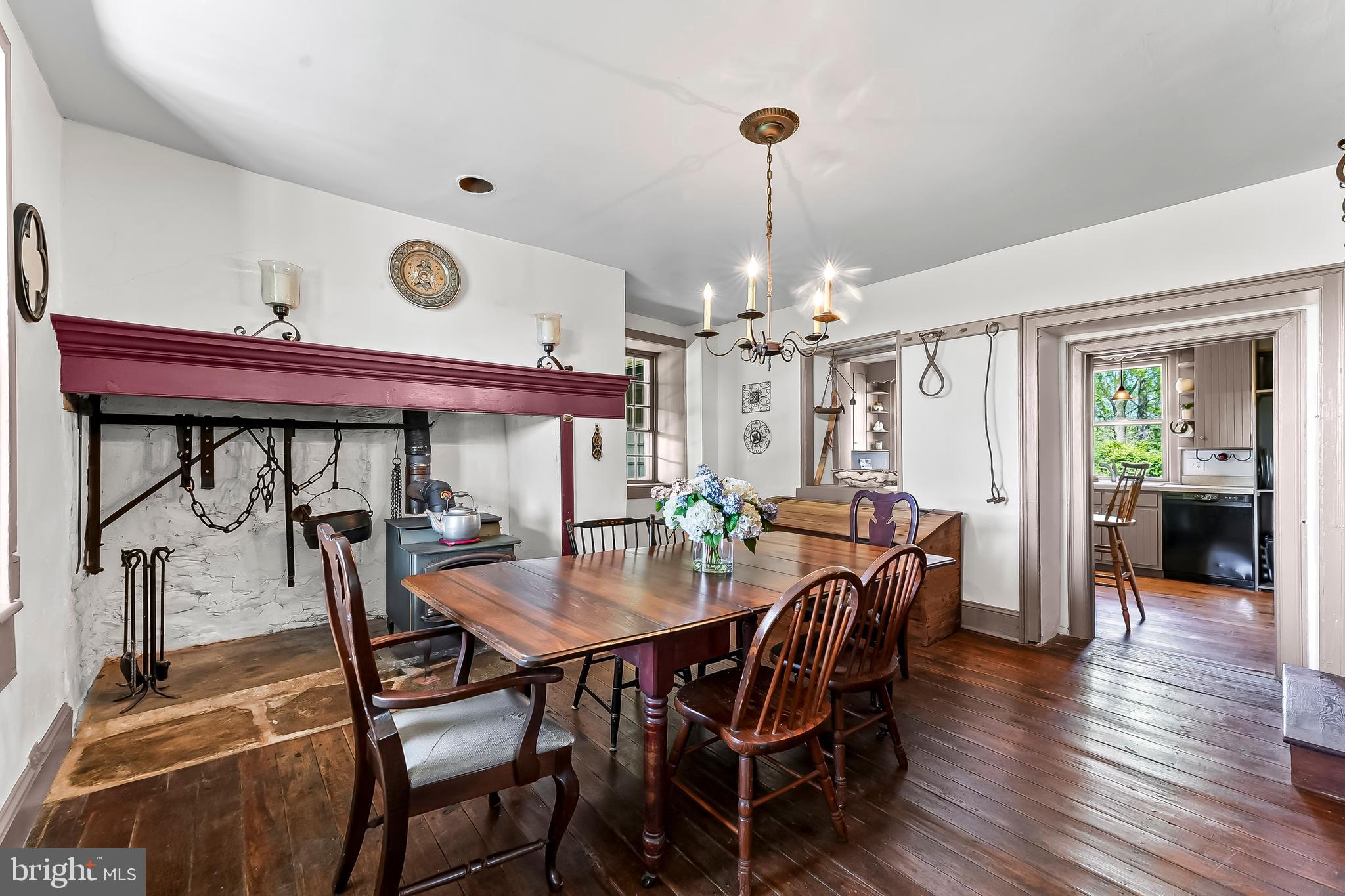 3058 Bailey Crossroads Road Atglen, PA 19310 - Photo 12 of 41 a view of a dining room and livingroom with furniture wooden floor a chandelier