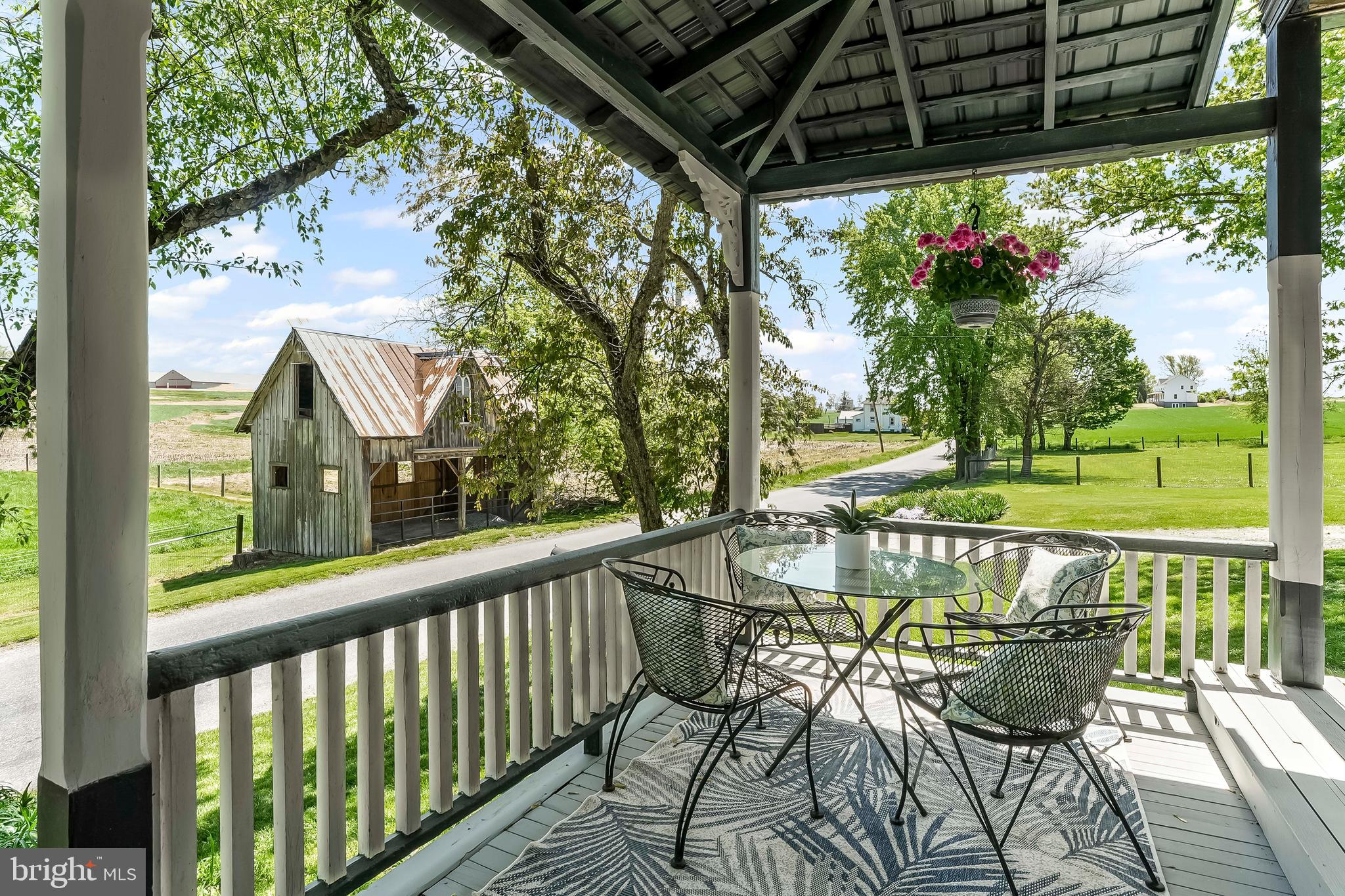 3058 Bailey Crossroads Road Atglen, PA 19310 - Photo 21 of 41 a view of a chairs and table in patio with wooden fence