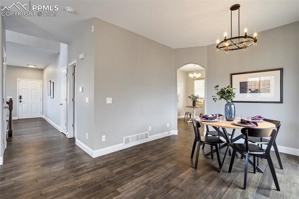 3140 River Valley View Colorado Springs, CO 80922 - Photo 13 of 49 a view of a dining room with furniture and wooden floor