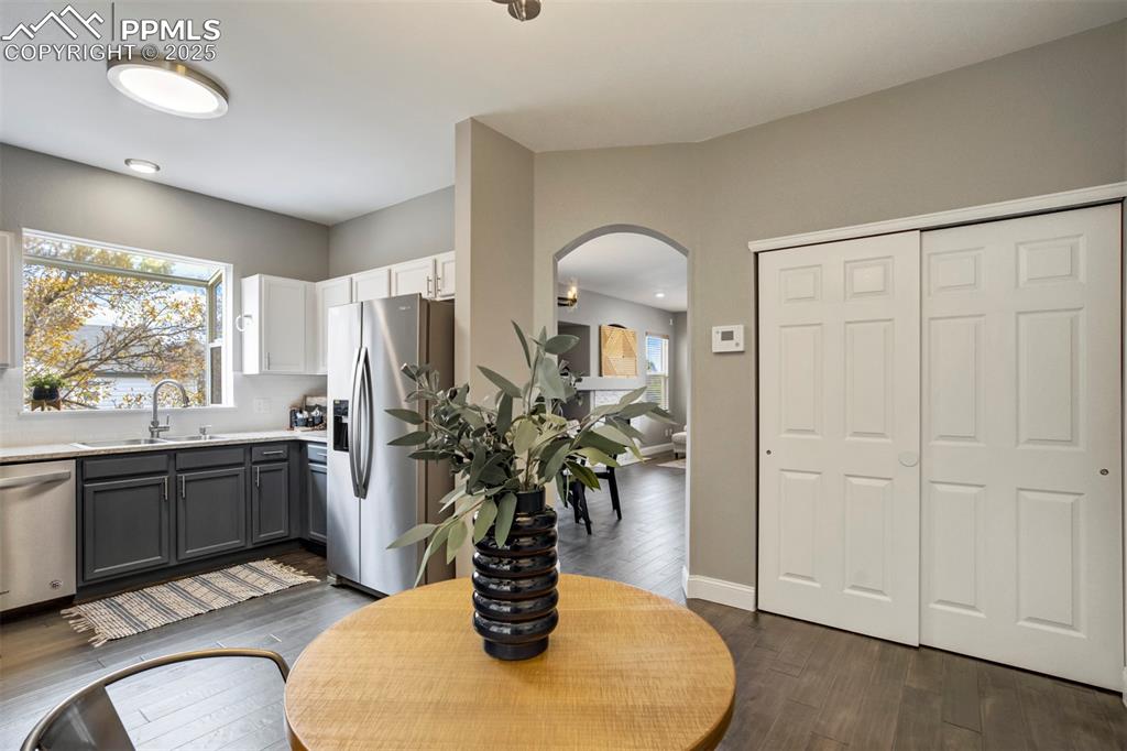 3140 River Valley View Colorado Springs, CO 80922 - Photo 16 of 49 a kitchen with stainless steel appliances granite countertop a potted plant on the counter and sink