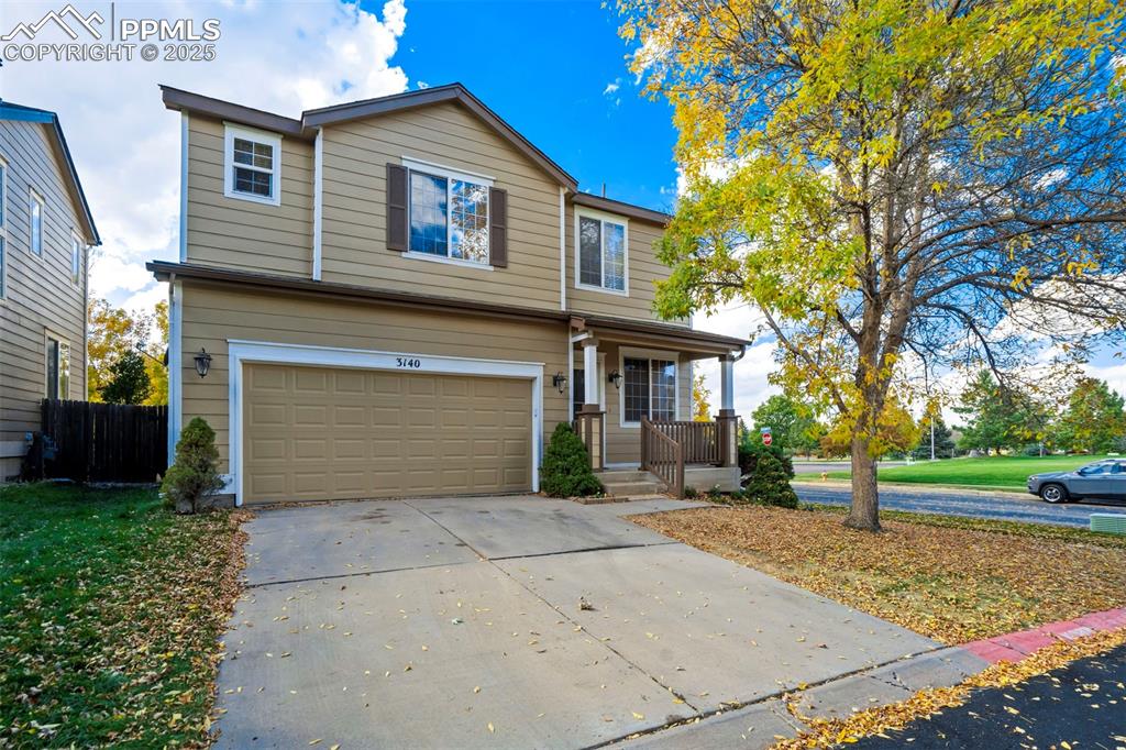 3140 River Valley View Colorado Springs, CO 80922 - Photo 2 of 49 a front view of a house with a yard and garage