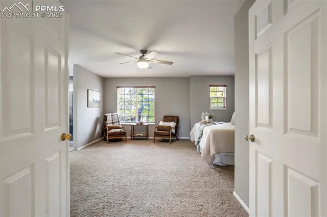 a spacious bedroom with a bed and a couch