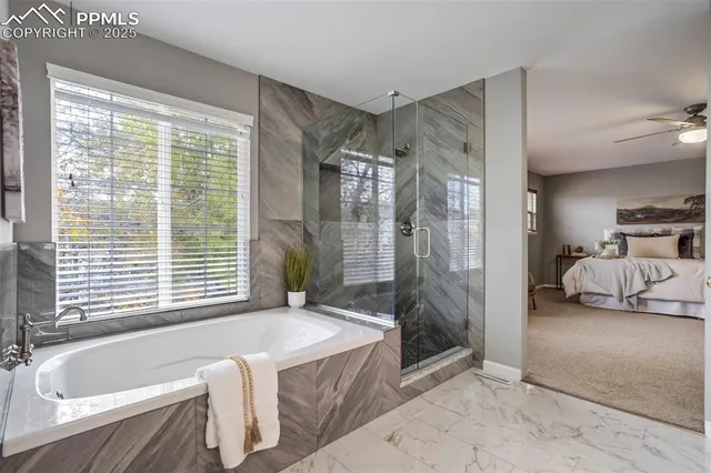 a en suite bathroom with double vanity and a mirror
