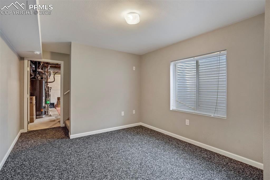 3140 River Valley View Colorado Springs, CO 80922 - Photo 30 of 49 a view of an empty room with a window