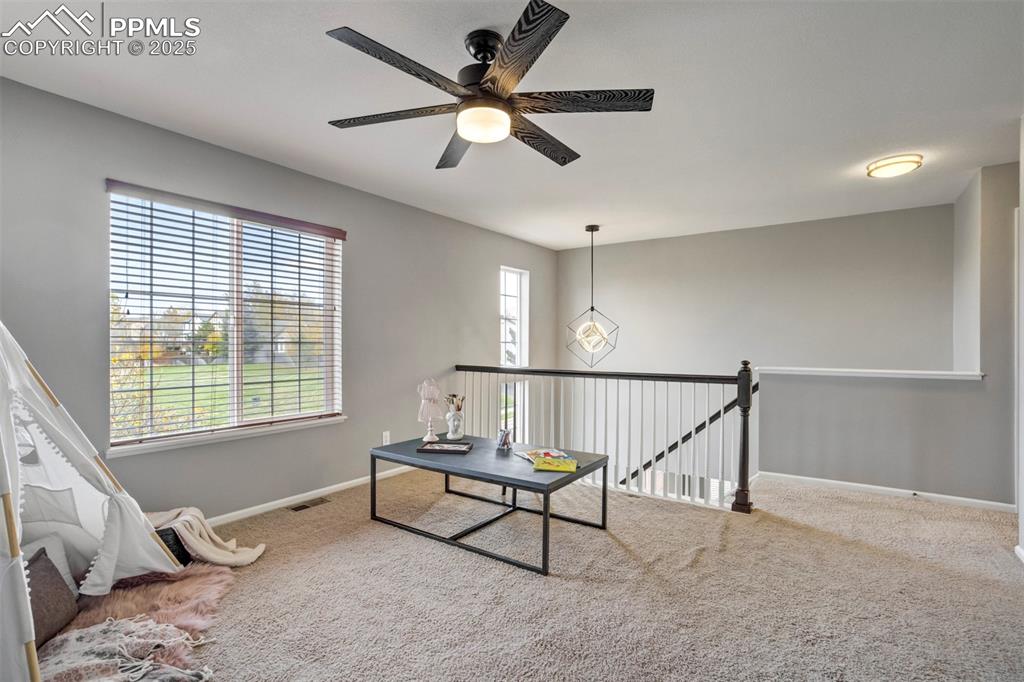3140 River Valley View Colorado Springs, CO 80922 - Photo 31 of 49 a living room with furniture and a window
